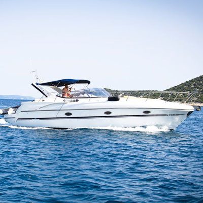 featured image of boat in water for winterize your marine diesel article